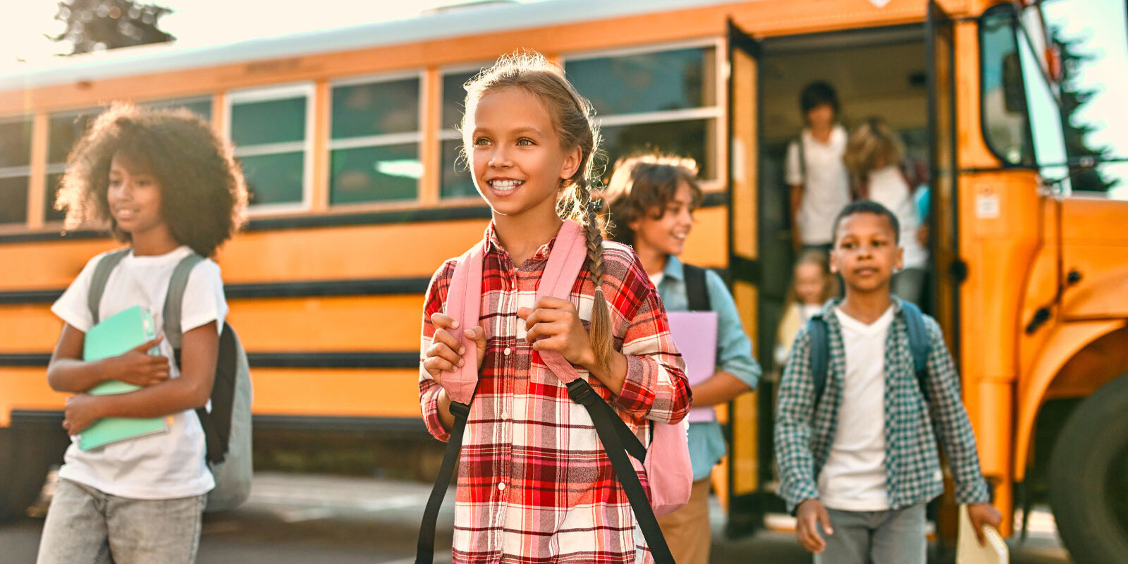 Kids getting off school bus