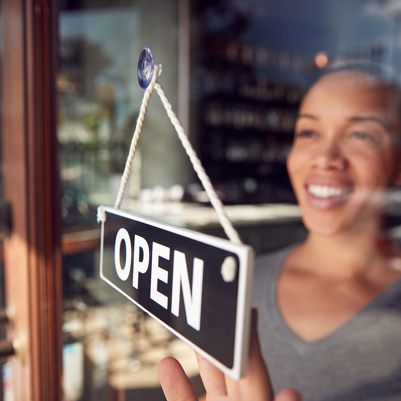 Business owner opening their shop